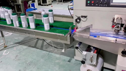 鋁制瓶子自動(dòng)套袋封口機(jī)